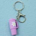 Cute purple PVC bubble tea cup keychain with white daisy patterns and silver metal clasp - Keychain / Purple Flower Cup Keychain