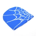 Macro shot of electric blue beanie featuring white spider web jacquard knitted pattern - Blue and White (K)