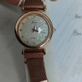 Macro detail of rose gold quartz watch with mesh band and sparkling diamond dial index - White with Flower