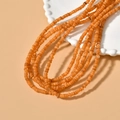 Macro detail of 4mm orange freshwater shell disc beads for DIY jewelry making - 7# Orange 4mm (1 Strand)