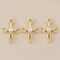 Detailed view of three 18K gold-plated baroque cross charms with oval clear zircon stones - #7 / 1.2*0.8cm / Gold