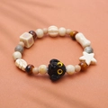 Cute handmade ceramic puppy bracelet with neutral beads and black poodle charm - Black