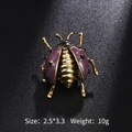 Vintage gold ladybug brooch with purple enamel wings and black gemstones on black surface - Purple Enamel Ladybug Style (XD8843-1) / 2.5x3.3cm