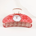 Detailed view of red Christmas hair claw clip with Santa and snowflake patterns - Style A (Santa & Snowflake)