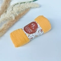 Detail of orange pleated cotton scarf with floral packaging and handmade label - Style #7