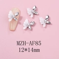 Macro shot of 12x14mm 3D white resin butterfly nail charms with pearl and rhinestone accents - White Resin Marquise Rhinestone Pearl Style (AF85)