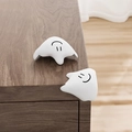 White silicone L-shape table corner protector with smiley face design for baby safety - Fluid-Pure White