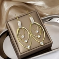 Elegant gold drop earrings with multi-layered crystal rhinestones on silk background - Gold Triple Layer Nested Rhinestone Long Earrings (E3515)