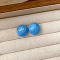 Macro detail of blue resin stud earrings with marble texture on beige velvet - Blue-Starry Sky-Ball