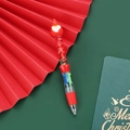 Kerst meerkleurige balpen met Kerstman-top en rode glitter in vloeibaar zand - Serie 1 - Kerstman