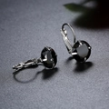 Silver leverback earrings featuring round black faceted crystals in a four-prong setting - Black (Round)