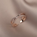 Crossed open ring in rose gold finish with small clear crystals on silk background - Rose Gold Cross
