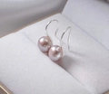 Macro shot of elegant pink-purple natural pearls on S925 silver hooks in jewelry box - White Gold / 9mm Purple Natural Pearl Earrings