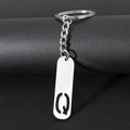 Silver metal keychain with letter Q pendant and sleek minimalist design features - Letter Q