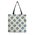 Detail of canvas tote bag featuring repeating blue Nazar eye pattern with black straps - Scattered Blue Eyes (hm2703)
