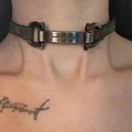 Close-up of olive green patterned leather choker with silver Gancini metal buckles - Metallic Silver Leather Necklace X3958A
