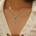 Silver butterfly necklace with zircon drop tassels for a stylish women's neck jewelry look - Tassel Butterfly Pendant Necklace (11979) / Silver