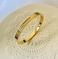 Polished 18K gold-plated stainless steel cuff bracelet with paved cubic zirconia stones - 6mm Zirconia Line Gold Bangle