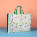 Floral non-woven shopping bag with green handles and white snap button closure - Wildflowers