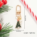 Detailed view of Christmas tree keychain with gold hardware and a white faux pearl charm - Pearl and Rhinestone Tree