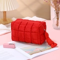 Portable red quilted makeup bag in a stylish home setting with lifestyle accessories - Octagonal Pouch / Red