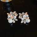 Detail of elegant gold earrings with faceted crystals and white faux pearls on black surface - 68# Silver Earring Post - Gold - Oval