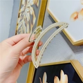 Elegant gold metal hair claw clip featuring rows of white pearls in a minimalist design - Moon Pearl