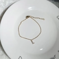 Minimalist 18K gold plated bracelet featuring a sparkling zircon initial L pendant charm - Letter L