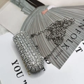Mini silver rhinestone lipstick bag with elegant chain strap on a fashion magazine - A029 Style / Silver