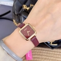 Elegant Mishali women's watch with square gold case and red leather strap on wrist - Square Smiley Dial