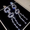 Detailed view of silver zircon tassel earrings with sparkling crystals on black velvet box - Silver-Waterdrop (38#Irregular Flower)