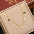 Golden necklace with emerald rectangle gemstones and star charms in a beige jewelry box - Star Pendant Two-Tone Gem Style (3#)