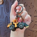 Mini bulldozer sleutelhanger in geel met een stevige metalen karabijnsluiting - Gele Bulldozer