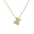 Detailed macro view of 18k gold-plated brass clover pendant with sparkling cubic zirconia - Letter X/Clover / Gold