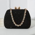 Sparkling black rhinestone clutch bag featuring a gold heart clasp and chain strap - Black