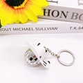 Disco ball keychain with a white cow-print cowboy hat and shiny mirror surface - Cow Print Cowboy Hat / 3cm Mirror Ball