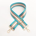 Detail view of 5cm wide striped shoulder strap with teal, white and gold metallic thread - Gold Buckle / Teal