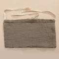 Detailed view of brown crinkled cotton storage bag with white herringbone tie straps - Dark Khaki