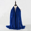 Blue cotton linen scarf with pleated texture and fringe tassels on a mannequin - Sky Blue
