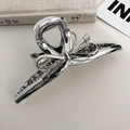 Detail of silver metallic bow hair claw clip on a minimal decorative background - Silver Large Bowknot