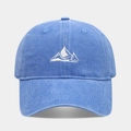 Macro detail of the white mountain peak embroidery on the navy blue washed cotton cap - Light Blue