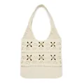 Detailed close-up of ivory crochet tote bag featuring green floral embroidery and hollow knit - Apricot