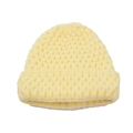 Detail of light yellow chunky knit texture on cozy winter beanie with rolled cuff - Yellow