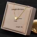 Detail of gold heart pendant in jewelry box with size specifications and weight info - 7168-12/Mini Heart