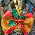 Detail of red and gold striped Christmas bow with green holly leaves and gold bell - Style 28-Red Gold Striped Bow Green Leaf Bell