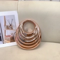 Elegant rose gold acrylic handbag with retro wavy texture and metallic finish - Champagne