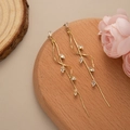 Detail of gold leaf tassel earrings with sparkling marquise cut cubic zirconia stones - Gold-White Zirconia
