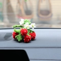 Detailed view of handmade strawberry car ornament with red berries and green leaves - Red Strawberry Pipe Cleaner Potted Plant