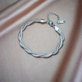Detailed macro view of the silver twisted stainless steel chain bracelet on silk fabric - Silver Double Twisted Bracelet (B776)