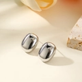 Macro detail of polished silver pebble stud earrings with a high-shine mirror surface finish - Rounded Rectangle (Silver)